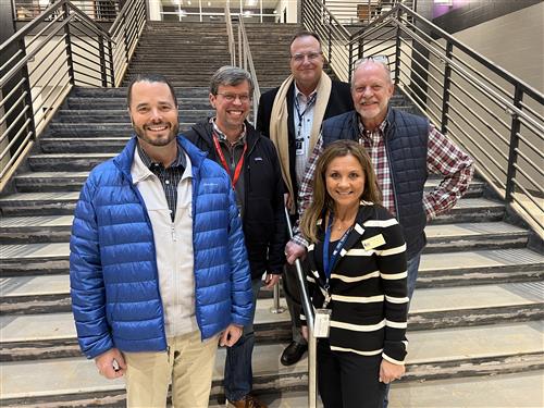 Board members and Dr. Nichols on staircase